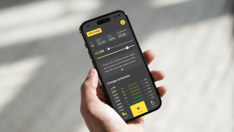 Hand holding smartphone displaying AI-based EV charging schedule app.