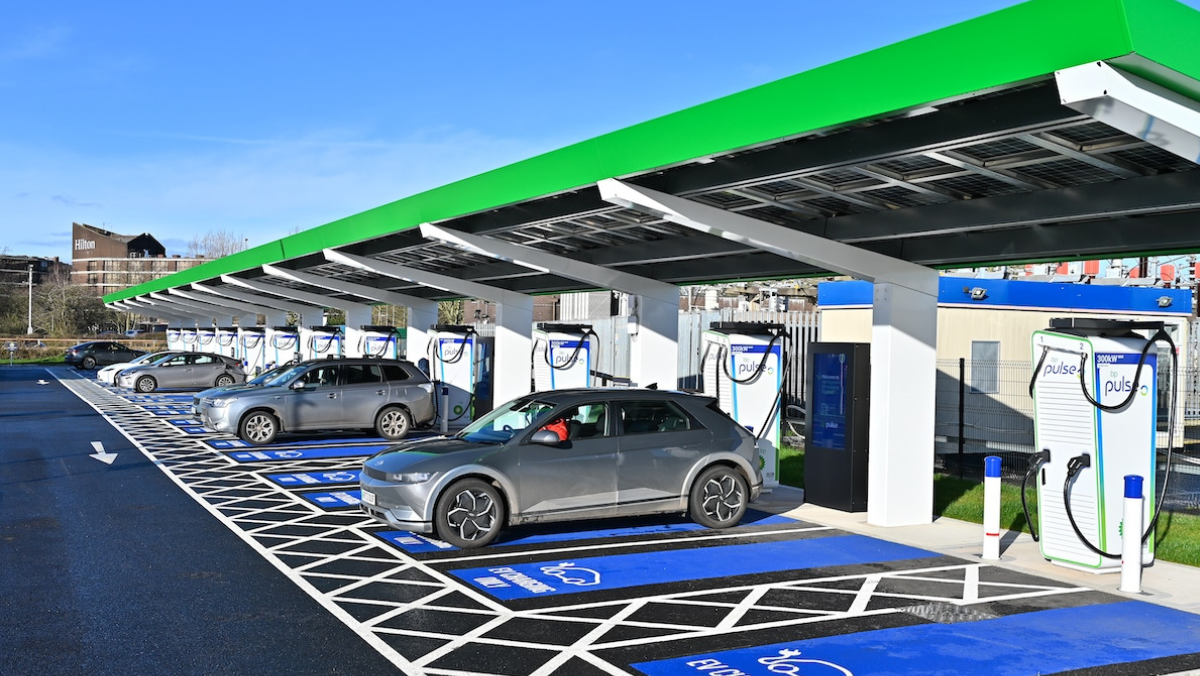 Electric vehicles charging at a covered public fast-charging site in the UK