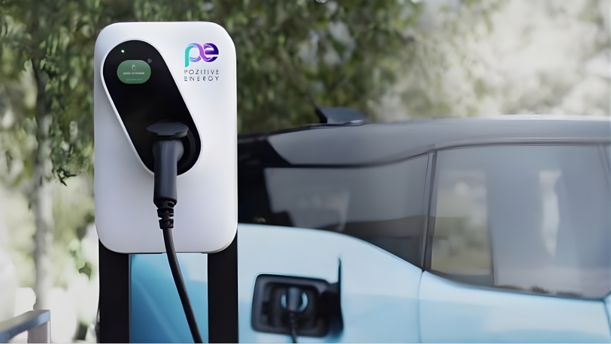 Electric vehicle charging station with car plugged in outdoors